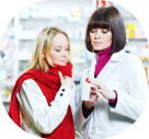 pharmacist suggesting medical drug to buyer in pharmacy 