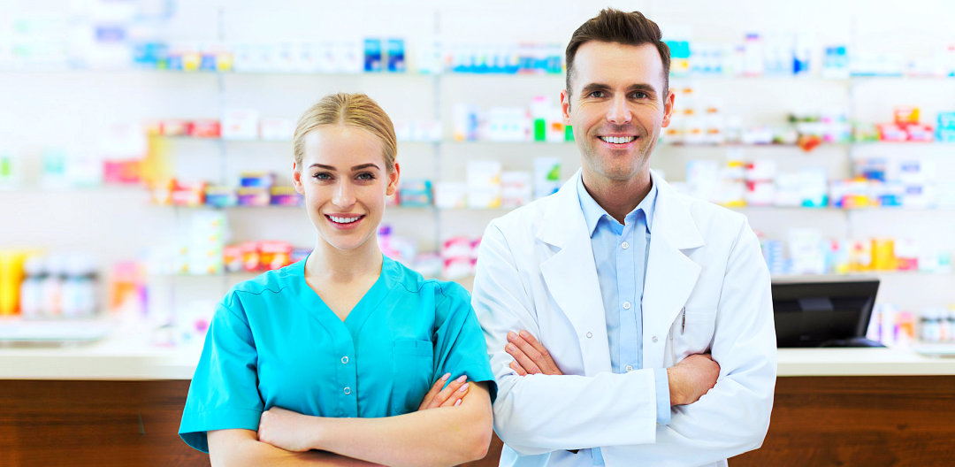 female and male pharmacists in pharmacy